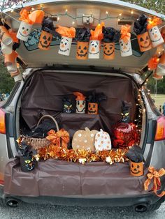 the trunk of a car decorated for halloween