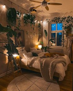 a bed room with a neatly made bed and lots of plants