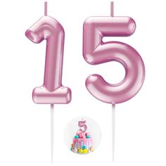 a pink number five candle with a birthday cake in the middle