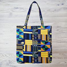 This gorgeous African Print Tote Bag/Shopper is modern, stylish, eco-friendly, durable, reusable and handcrafted with 100% quality cotton wax fabric. Keep this multifunctional Tote Bag in your handbag at all times to prevent you from constantly purchasing plastic bags at the store, take it to the park packed with toys, books etc for the kids or match this long strapped, roomy Tote Bag with your outfit and wear over the shoulder to carry your daily items. The reusable Tote Bag is light and compac Modern Blue Cotton Bags, Modern Cotton Rectangular Shoulder Bag, Eco-friendly Fabric Bag For Everyday Use, Eco-friendly Fabric Bags For Everyday, Eco-friendly Fabric Rectangular Bags, Eco-friendly Rectangular Fabric Bag, Eco-friendly Fabric Shoulder Bag For Everyday, Hamam Towel, Tote Bag Beach