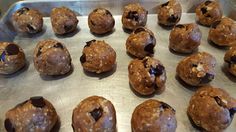 chocolate chip cookie doughnuts on a baking sheet ready to go into the oven