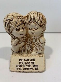 two little figurines are standing next to each other on a white surface with the words me and you, you and me that's the way it'll always be