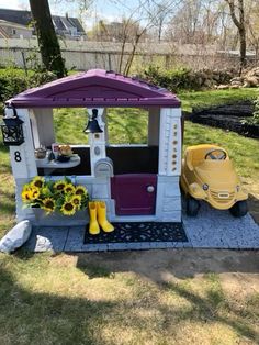 a small toy car is parked in the yard