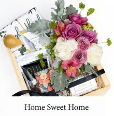 the home sweet home box is filled with flowers and other things to put in it