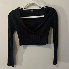 Black V-Neck Top. Never Worn, Perfect Condition. Very Soft Material. Crop Length Long Sleeve. Black Stretch V-neck Crop Top, Black V-neck Crop Top For Spring, Chic Black V-neck Crop Top, Black V-neck Top For Night Out, Black Casual V-neck Crop Top, Casual Black V-neck Crop Top, Black V-neck Top For Fall, Casual V-neck Crop Top For Night Out, Casual Black V-neck Top For Night Out