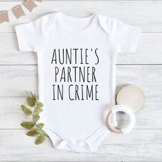 Auntie's Partner In Crime Baby Bodysuit, Cute Baby Clothes, Baby Bodysuit, Baby Shower Gift, Aunt To Be Gift, Aunt Pregnancy Announcement 💗  Welcome to The WildflowerbyMiley Etsy Shop!  This listing is for the bodysuit, sweatshirt or t-shirt only. All other items that are shown in our photos such as shoes, hats, beanies, blankets etc. are for photo staging purposes and are NOT INCLUDED in the sale. DESCRIPTION:  This baby and children's unisex essential fits like a well-loved favorite. Super so Your Gonna Be An Aunt Announcement, Auntie Proposal Ideas, Aunt Shirts For Babies, New Auntie Gifts, Your Going To Be An Aunt, Aunt Baby Onesie, Baby Announcement To Parents Christmas, Auntie Onsies For Babies, Pregnancy Announcement To Sister Aunt