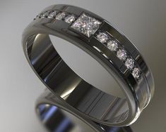 a wedding ring with three princess cut diamonds on the inside and outside, set in 18k white gold