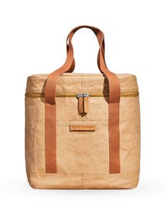 a tan bag with brown straps on it