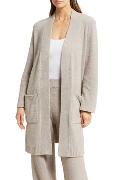 Maximize the coziness of your weekend look in this longline cardigan complete with roomy front pockets. 37 1/2" length (size Medium)   Long sleeves   Front patch pockets   70% recycled polyester, 30% polyester   Machine wash, tumble dry   Imported    This garment was made in a factory that supports women-worker empowerment through HERproject, which creates partnerships to enable workplace-based interventions on health, financial inclusion and gender equality