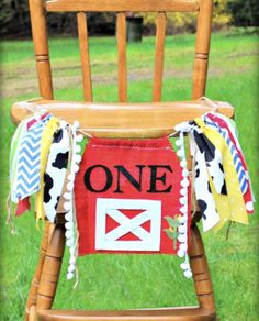 a wooden chair with a one sign on it