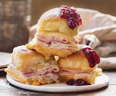 a stack of pastries sitting on top of a white plate