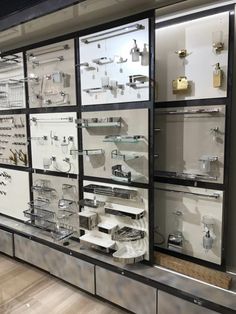 a display case filled with lots of silver items