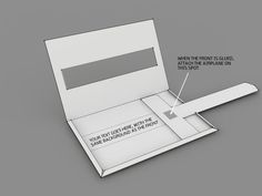 an open laptop computer sitting on top of a gray surface with instructions to insert the screen