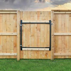 a wooden fence with metal bars on it