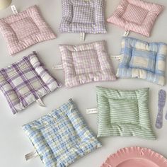 small cushions and plates are laid out on the table