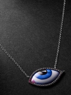 Lito's necklace is strung with a signature 'Tu Es Partout' evil eye amulet, enamelled in shades of blue, white and black – its substantial size means you can really appreciate the pendant's artful hyperrealism. It's set into blackened white gold and suspended from a slim matching chain. Brilliant-cut blackened diamonds and rubies trace the outline. Mens Diamond Necklace, Evil Eye Amulet, Blue Diamond Jewelry, Ruby And Diamond Necklace, Fine Gold Jewelry, Mens Gold Jewelry, Enamel Necklaces, Gold Diamond Necklace, White Gold Necklaces