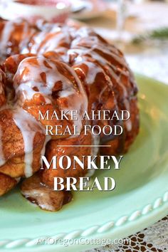 a green plate topped with monkey bread covered in icing and drizzled