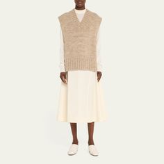 Maison Margiela knit sweater vest V neckline Cap sleeves Relaxed fit Open sides Pullover style Alpaca/cotton/wool Made in Italy Sweater Vest Open Sides, Casual Beige Cashmere Sweater Vest, Chic Wool Sweater Vest For Layering, Sleeveless Wool Sweater Vest For Fall, Fall Sleeveless Cashmere Sweater Vest, Wool Sweater Vest For Layering, Cashmere Fine Knit Sweater Vest For Fall, Fine Knit Cashmere Sweater Vest For Fall, Spring Wool Sleeveless Sweater Vest