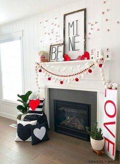 a living room decorated for valentine's day with red, white and black decorations