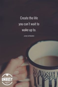 a person holding a coffee cup in their hand with the quote create the life you can't wait to wake up to