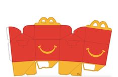 three red and yellow boxes with faces drawn on them, one has a smiling face