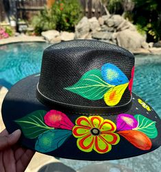 Beautiful handmade painting Mexican hat this beautiful handmade painting Mexican hat is perfect to add that special touch to any outfit  this hat is structure with high crown an the wide brim had beautiful painting designs  very important about shipping  all items in LTFMEX are shipping in corrugated box for protect our products Black Wide Brim Hat For Cinco De Mayo, Handmade Panama Hat For Kentucky Derby, Unique Handmade Fedora For Beach, Unique Handmade Fedora For The Beach, Unique Handmade Hat Bands For Beach, Hand Painted Curved Brim Sun Hat For Festivals, Handmade Multicolor Fedora Sun Hat, Custom Hand Painted Brimmed Fedora, Hand Painted Brimmed Hats For Kentucky Derby