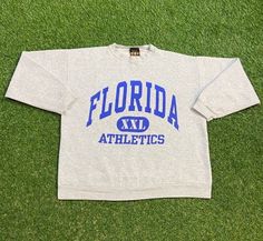 Vintage University of Florida Gators Sweatshirt Good Condition Made by TSI Sportswear in the USA Each Vintage item is unique and fits differently. Please refer to measurements for the best fit.  Size Large  Width 22.5 in  Length 25.5 in *Follow LegacyVintage on Instagram* * I ship all items in two or three business days and utilize Priority Mail options via USPS. Expedited shipping is available upon request. If you have any questions; Please Ask! * All of my items are pre-owned and, unfortunatel Sweat Vintage, Shirt Packaging, Vintage University, University Of Florida, Priority Mail, Alligator, Crewneck Sweatshirt, Favorite Outfit