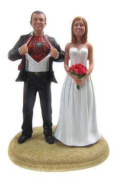 a wedding cake topper with a bride and groom