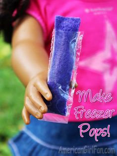 a close up of a doll holding a purple object with the words make freeze pops on it