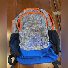 Adidas Backpack, Brand New Without Tags, Colors: Grey, Blue, Orange. Clean Inside, Working Zippers, 2 Big Pockets To Hold Your Items Casual Orange Sports Bag, Casual Blue Bags, Functional Orange Backpack For School, Blue Sporty Backpack For School, Blue Casual Sports Backpack, Casual Blue Sports Backpack, Adidas Backpack, Big Pockets, Grey Blue