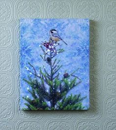 a painting of a bird sitting on top of a pine tree with snow flakes