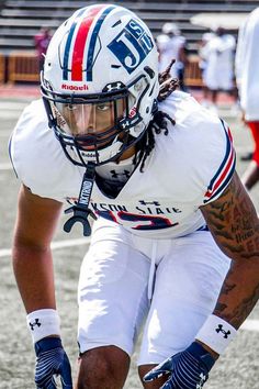 a football player kneeling down on the field