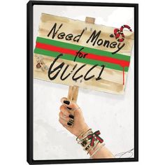 a hand holding a sign that says need money for gucci with red, green and white stripes