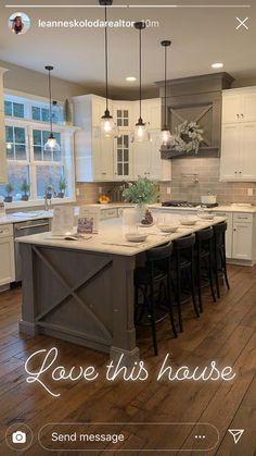 a large kitchen with an island in the middle and lots of stools around it