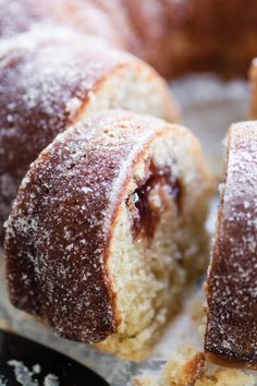 some sugar covered donuts are sitting on a table