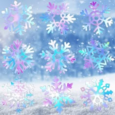 several snowflakes are shown in different colors on the window sill, and one is