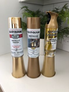 three different types of metallic paint on a counter