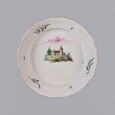 a white plate with an image of a house on it