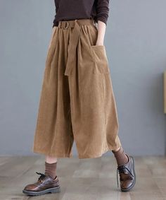 Crafted for the scholarly chic, these pants in brown, green, and khaki epitomize the Dark Academia aesthetic. High-rise with classic pleats, they pair seamlessly with brogues or a cozy sweater. Ideal for vintage aficionados seeking a hint of modern flair. Dark academia aesthetic Two front pockets Loose fits High waist Cotton, corduroy material Belt not included Plus Size Dark Academia, Cottagecore Clothes, Aesthetic Clothing Stores, Cropped Wide Leg Pants, Casual Wide Leg Pants, Winter Pants, Fall Fabric, Corduroy Skirt, Korea Fashion