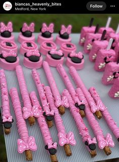 there are many pink items on the table with black dots and bowknots