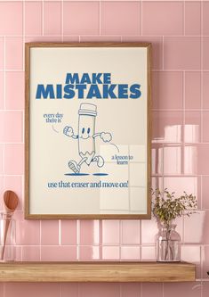 a pink tiled wall with a framed poster on it that says make misstakes