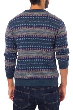 Step out in style, with this chic trendy sweater. Precisely knitted motifs surround this handsome men's sweater from Peru's Fernando Cano. Working in luxurious alpaca wool, he creates a design of intricate geometry in shades of blue and grey with purple accents. Alpaca Dry cleaning recommended Textile softness: Soft -- this item has been made with natural fibers that are soft to the touch Handmade in & fairly traded from Peru Fall Blue Alpaca Sweater, Blue Alpaca Long Sleeve Sweater, Casual Merino Wool Sweater With Fair Isle Pattern, Casual Wool Sweater With Fair Isle Pattern, Blue Long Sleeve Alpaca Sweater, Wool Jacquard Knit Crew Neck Cardigan, Blue Wool Sweater With Fair Isle Pattern, Trendy Sweater, Paw Print Jewelry