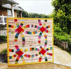 a wooden wall that has been made to look like an abstract piece of art on it