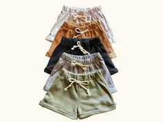 Get your little one ready for summer in the cutest French terry shorts! These unisex shorts provide a relaxed fit and are cuffed at the bottom for added style. Perfect for minimalist, boho and casual looks, they come in a variety of cool colors in sizes 12-18 Months, 2T, 3T, 4T, 5T, Size 6. Let your toddler have some fun in the sun with these comfy shorts! #toddlerclothing #toddlerfashion #boymom #minimalist #babyshop #genderneutraltoddler Playful Cotton Bottoms For Beach Season, Summer Playwear Shorts With Pockets, Drawstring Shorts For Playwear In Spring, Cute Cotton Shorts In Solid Color, Drawstring Shorts For Spring Playwear, Spring Drawstring Shorts For Playwear, Sporty Bottoms For Beach Season Playwear, Sporty Bottoms For Beach Playwear, Cute Cotton Shorts For Beach Season