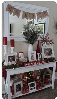 a white table topped with pictures and christmas decorations