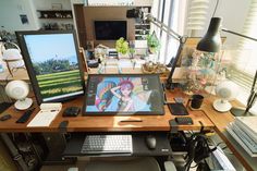 a computer desk with two monitors, keyboard and mouse on it in front of a window