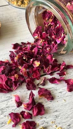 dried rose petals spilling out of a jar