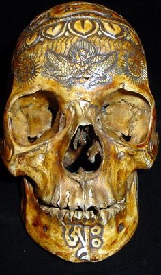 a human skull with intricate designs on it