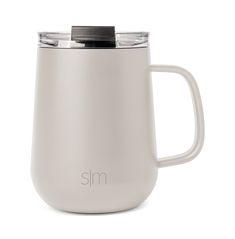 a white coffee mug with a lid and handle