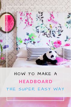 a panda bear laying on top of a bed next to a wallpapered headboard